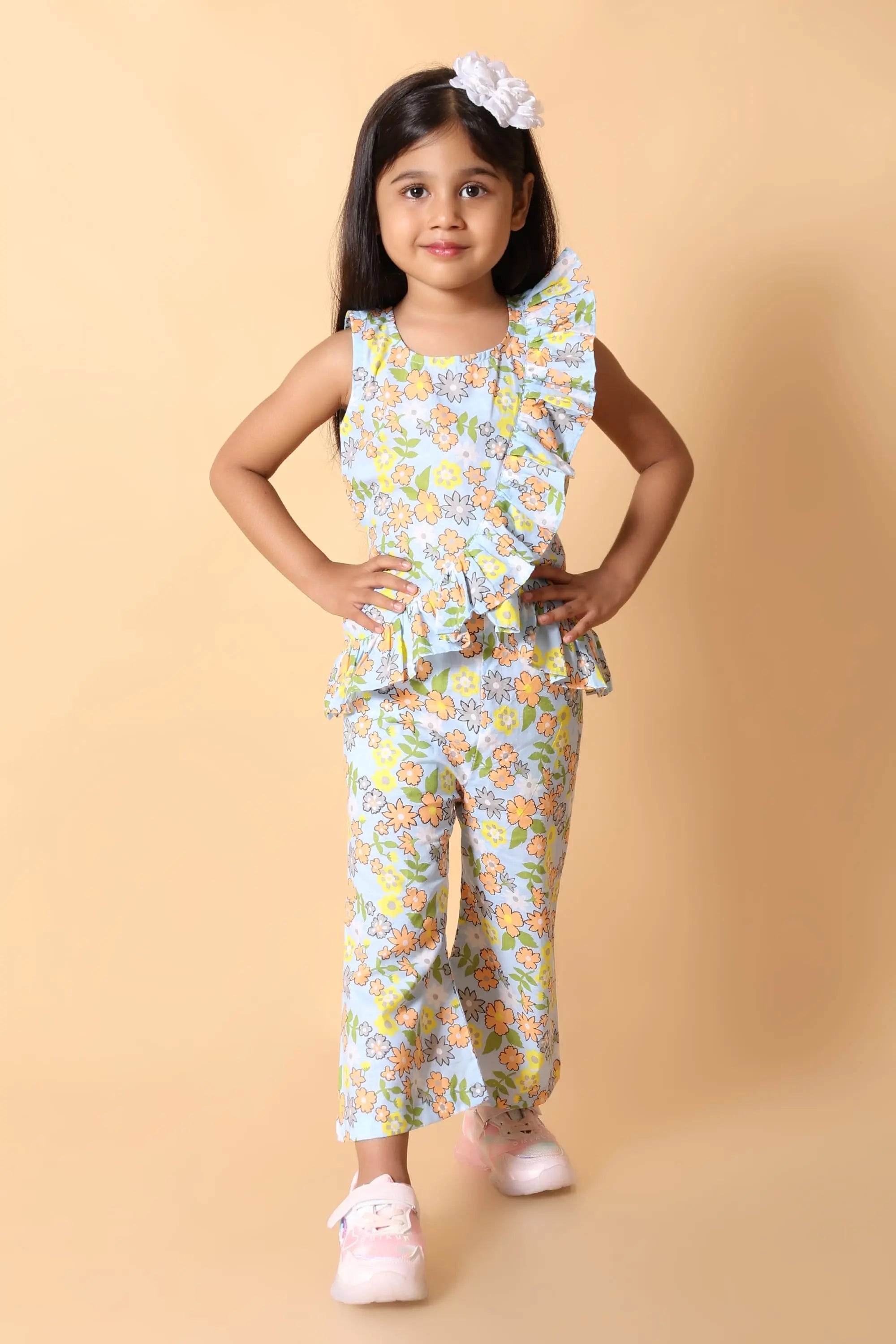 Girl in sky blue floral ruffle coord set – kids size guide by age
