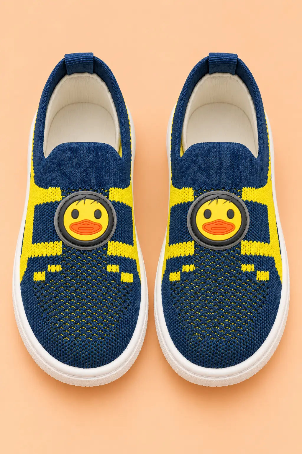 Top view of navy blue kids sock sneakers pair showing padded insole and duck face patch