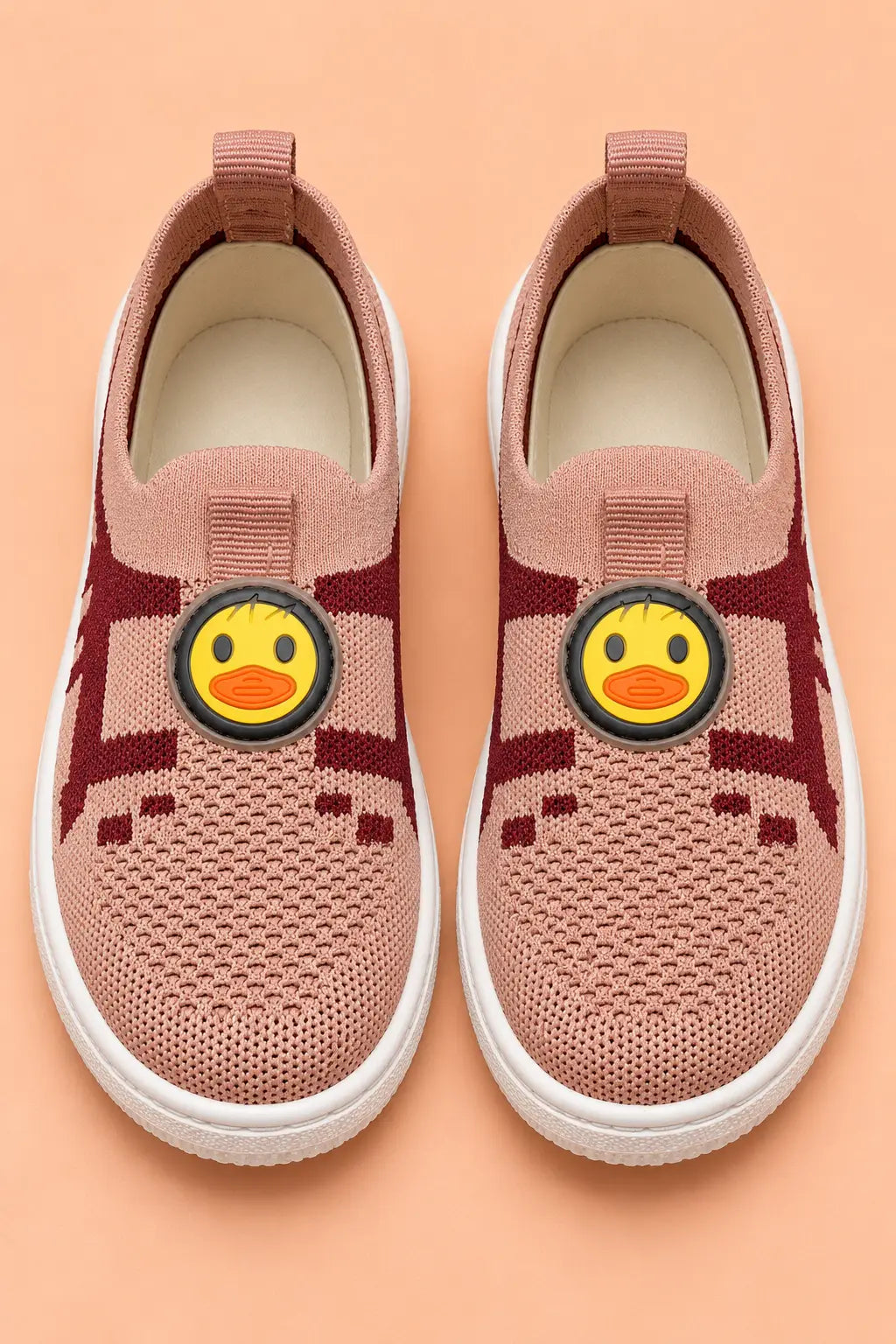 Top view of kids sock sneakers pair showing padded insole, front pull loop and duck face patch