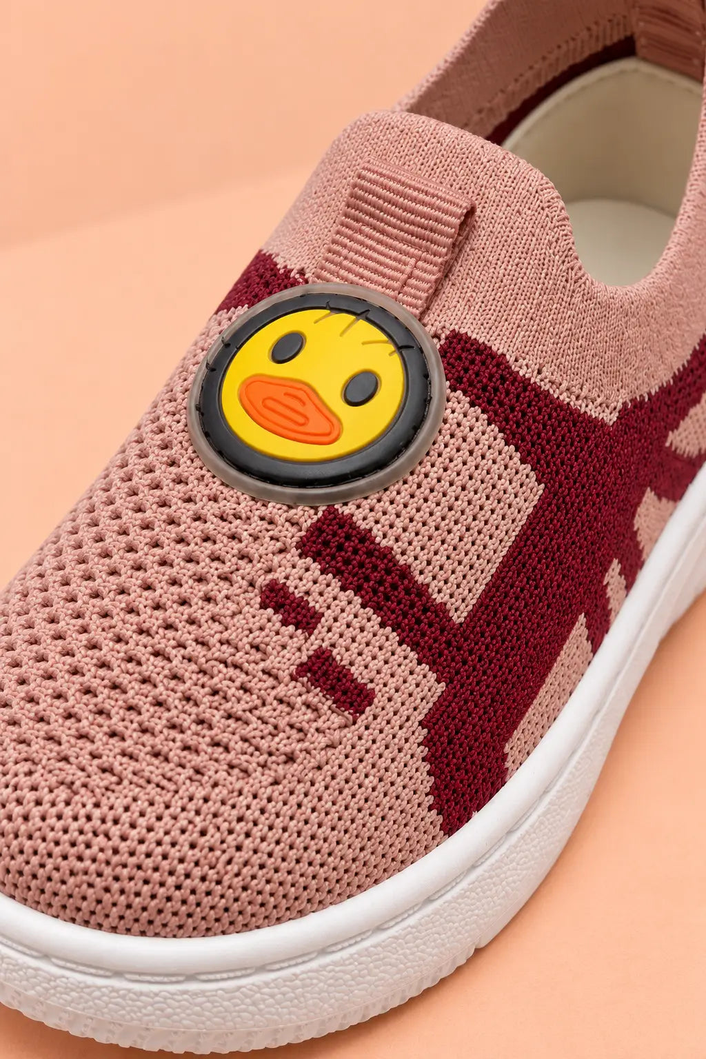 Close-up of breathable knitted mesh upper and rubberised duck patch on Bebe Unicorn kids shoes