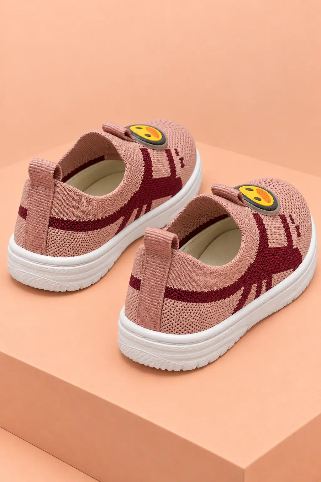 Back view of kids slip-on shoes with heel pull tabs for easy on and off