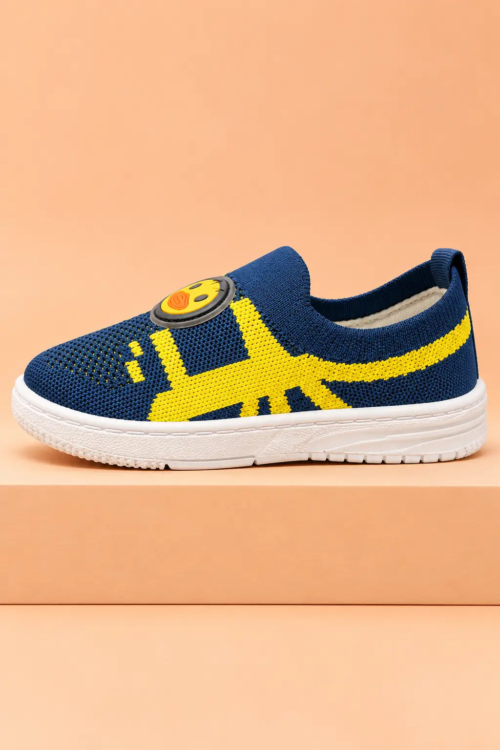 Inner side view of unisex kids knit shoes in navy blue with bright yellow pattern