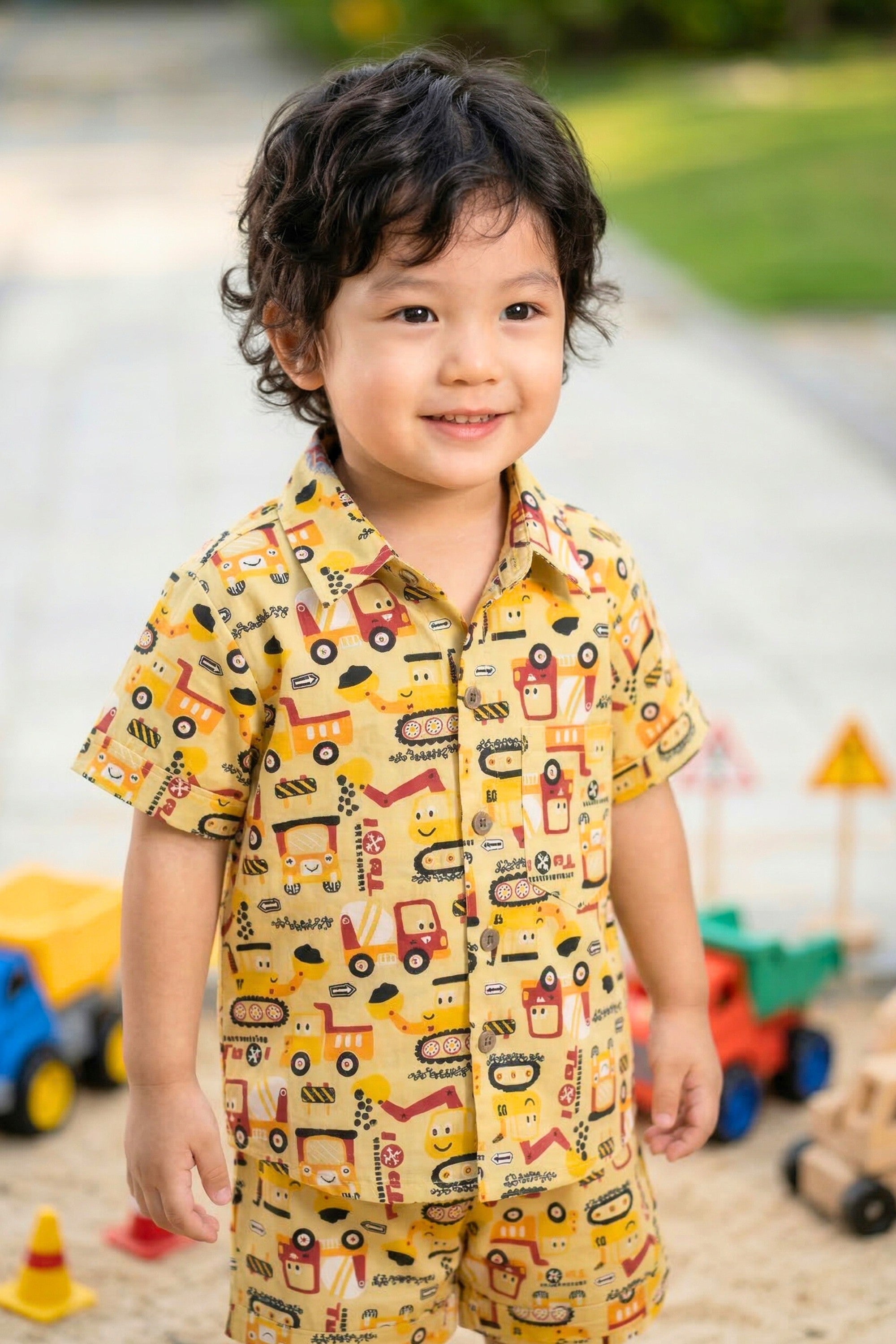 Boys construction vehicle print coord set mustard yellow — JCB digger shirt and shorts front view Bebe Unicorn
