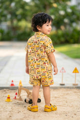 Coconut shell buttons on boys mustard yellow construction print cotton shirt — eco-friendly coord set Bebe Unicorn