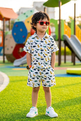Young boy age 4-5 playing outdoors in boys dinosaur casual shirt + shorts set, perfect for school wear & everyday casual outfit, 100% cotton