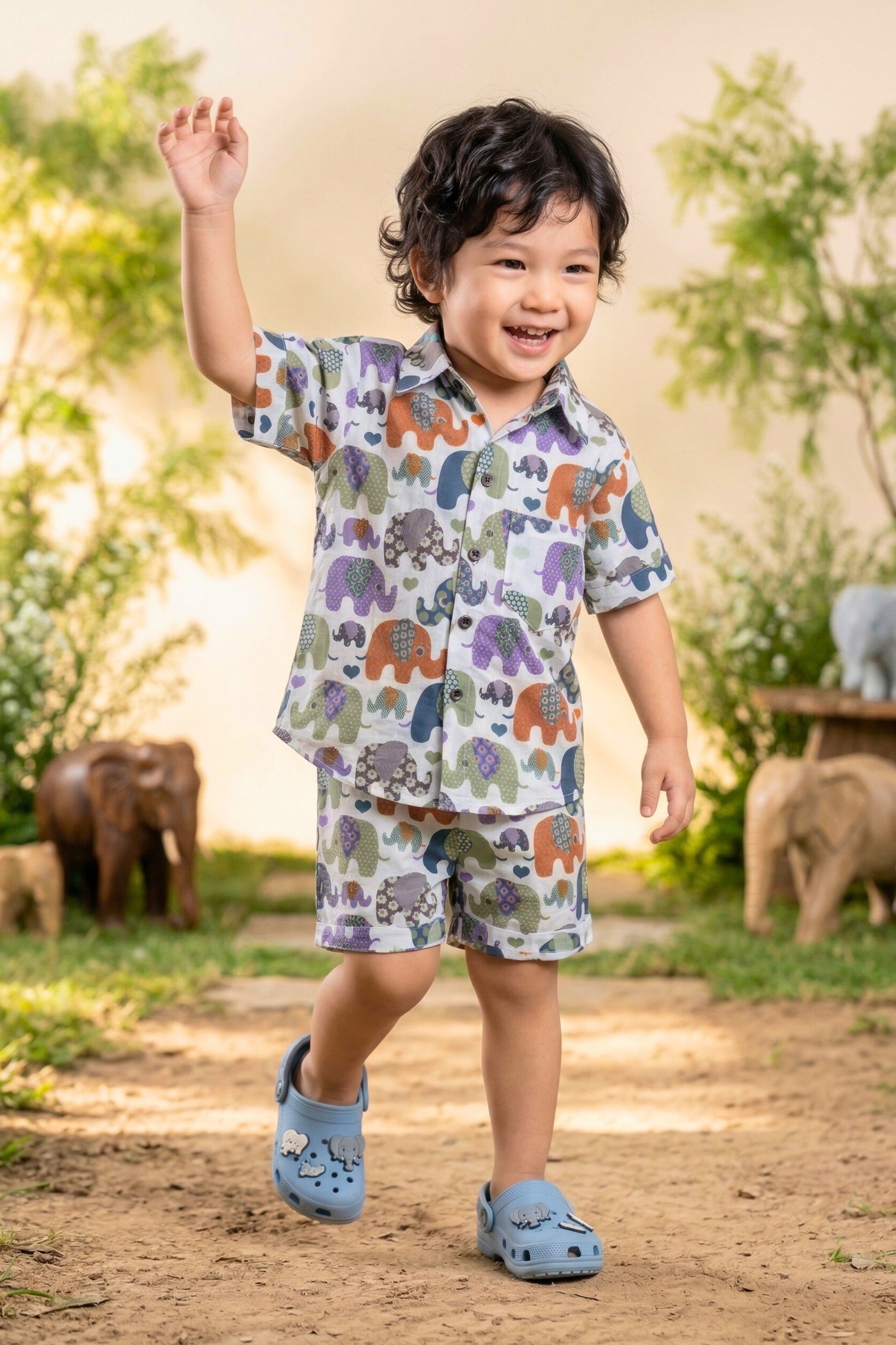 Flat lay of the Bebe Unicorn Boys Multicolour Elephant Parade Print 100% Cotton Coord Set — a boys elephant-themed birthday outfit and zoo trip outfit, suitable for daily wear, summer outings and gifting. Priced at ₹699, made in India, available in sizes 2–8 years.