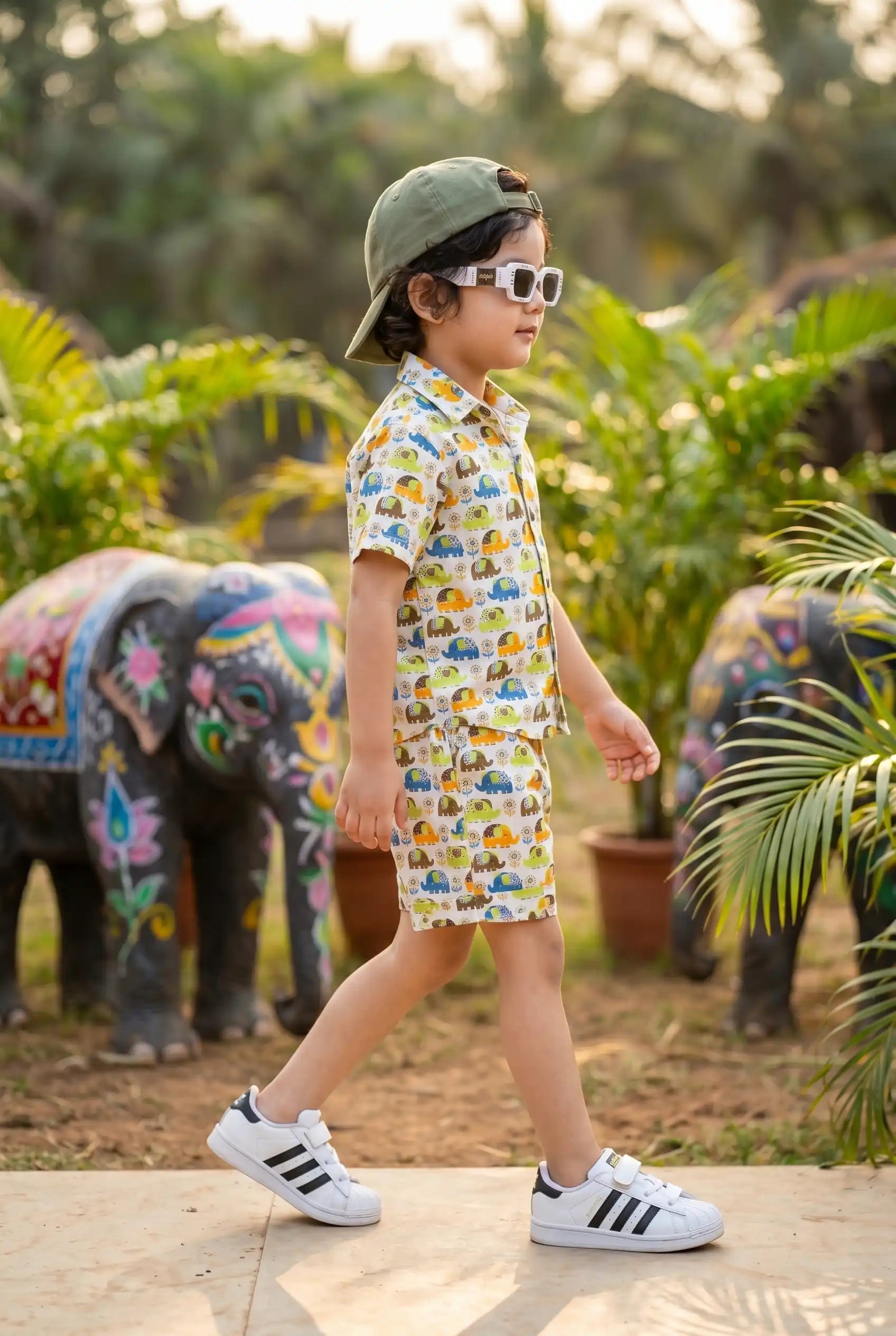 Young boy age 4-5 playing outdoors in boys elephant casual shirt + shorts set, perfect for birthday parties, school wear & summer outings, 100% cotton, colorful elephant print