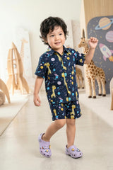 Flat lay of the Bebe Unicorn Boys Navy Space Giraffe Print 100% Cotton Coord Set — a unique boys birthday outfit for space and animal lovers, suitable for daily wear, summer outings and gifting. Priced at ₹699, made in India, available in sizes 2–8 years.