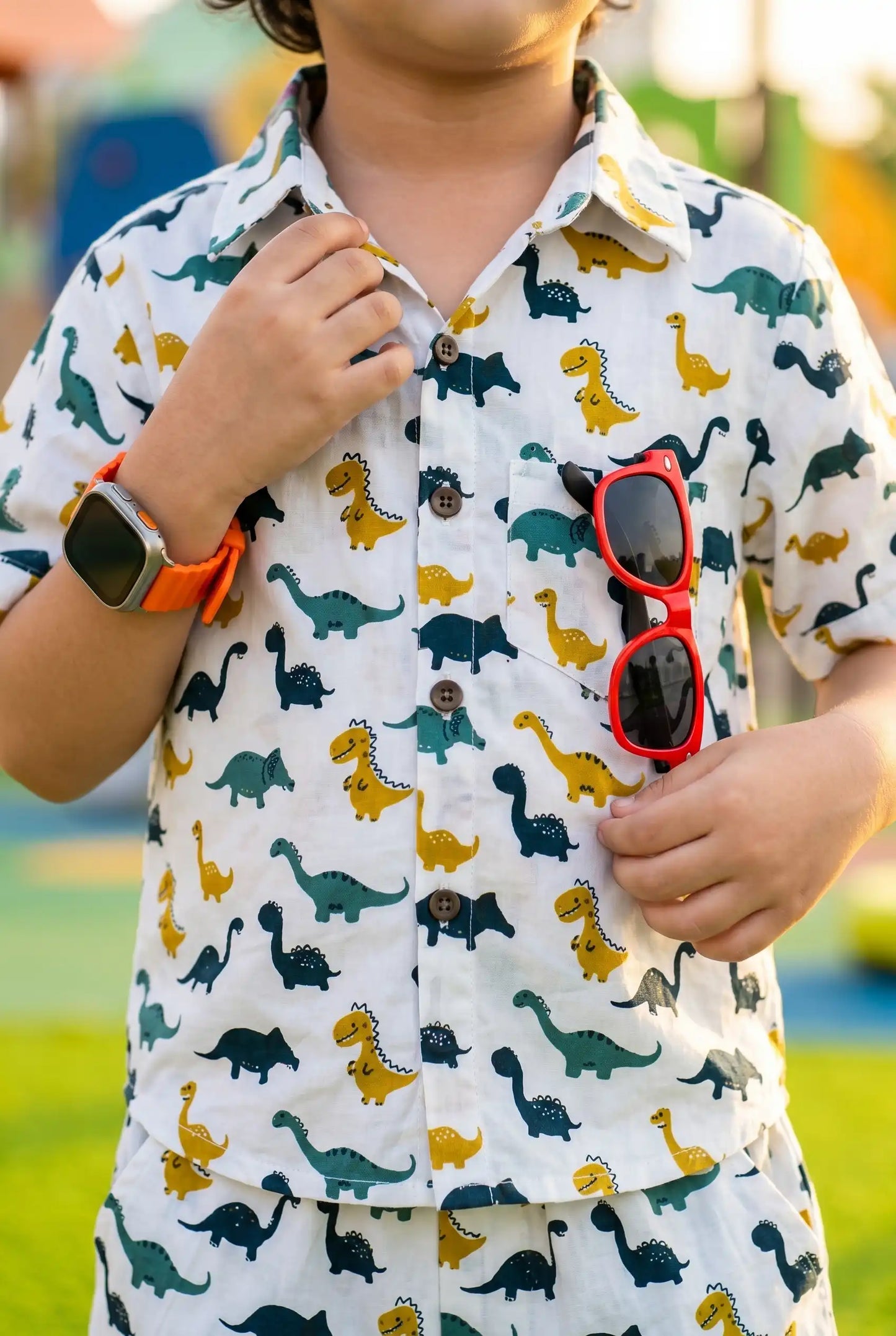 Boys dinosaur print shirt showing button-down detail, T-Rex Triceratops long-neck dinos, school wear casual outfit, ages 2-8