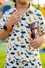 Boys dinosaur print shirt showing button-down detail, T-Rex Triceratops long-neck dinos, school wear casual outfit, ages 2-8