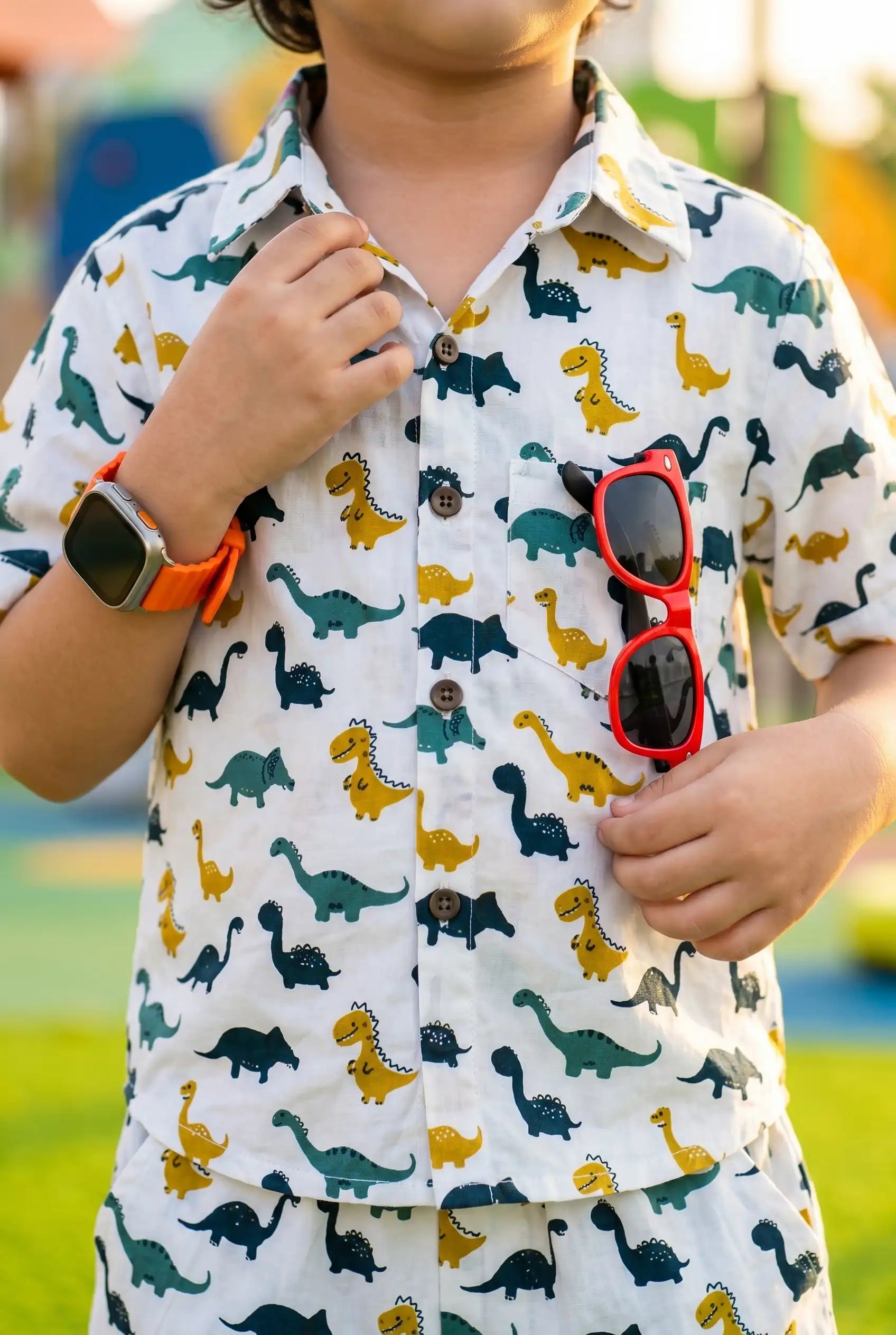 Boys dinosaur print shirt showing button-down detail, T-Rex Triceratops long-neck dinos, school wear casual outfit, ages 2-8