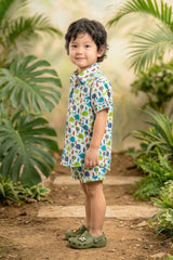 Close-up of elephant hot air balloon jungle print on white cotton fabric — boys safari coord set