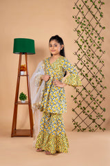 Diwali ethnic wear for girls in yellow floral sibling set (Rakhi) with kurta, palazzo, and net dupatta, perfect for festive celebrations.