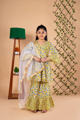 Diwali ethnic wear for girls in yellow floral sibling set (Rakhi) with kurta, palazzo, and net dupatta, perfect for festive celebrations.