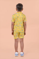 Lifestyle pose – boys yellow shirt & shorts set for holidays and playdates