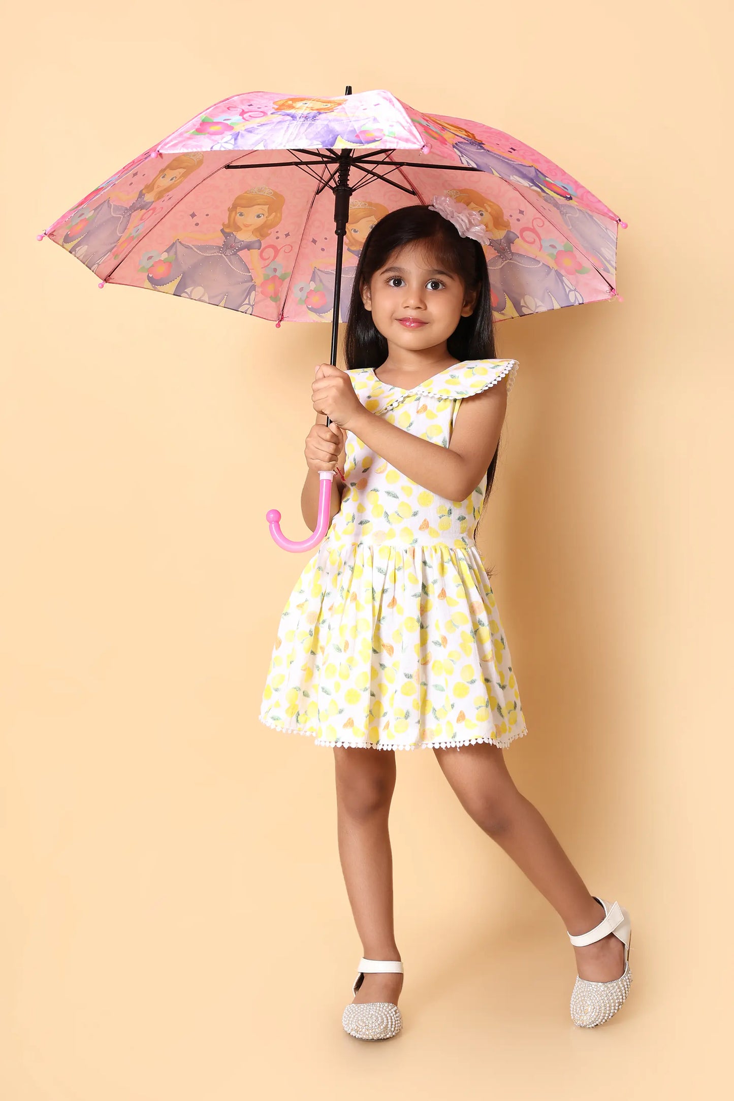 Back view – girls sleeveless lemon print dress with flared hem