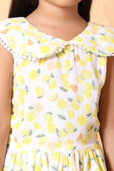 Twirl pose – light and airy kids summer dress with lemon pattern