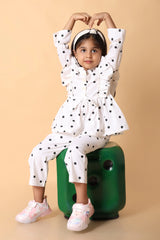 Detail – puff sleeves and buttons on girls polka set, party ready