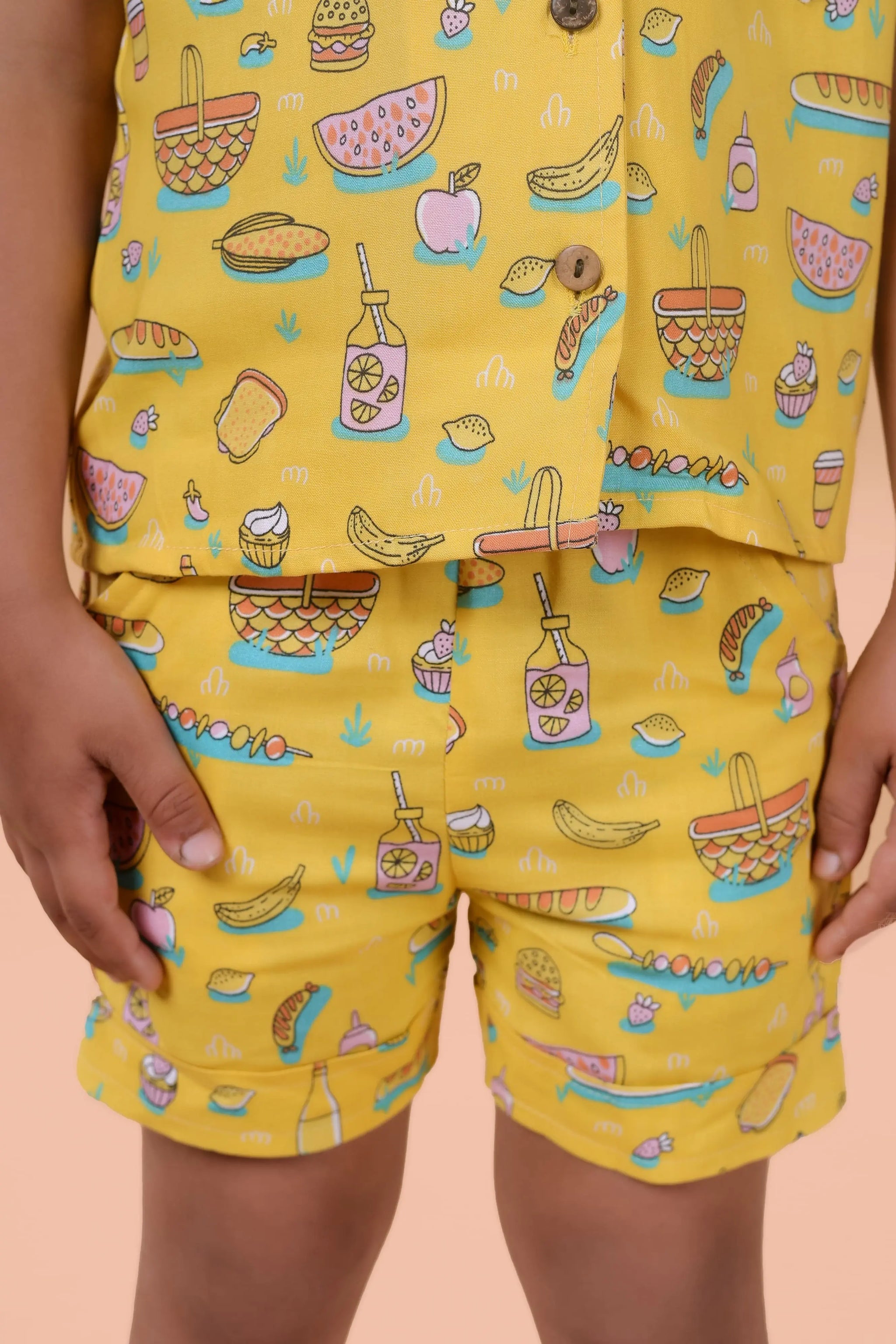 Side view – boys yellow matching shirt & shorts, lightweight summer wear