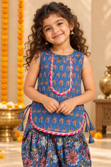 Girl wearing blue block print sleeveless kurti with pink gota yoke, close-up front view – Bebe Unicorn