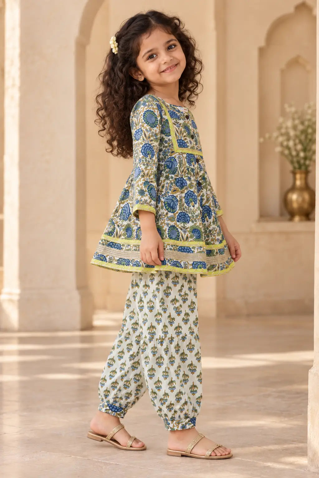 Side view of girls ivory floral kurti salwar set showing A-line flare and gota hem – Bebe Unicorn