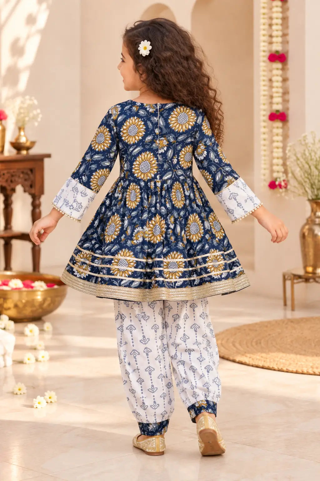 Back view of girls navy sunflower kurti with bell sleeves and ivory printed afghani salwar – Bebe Unicorn