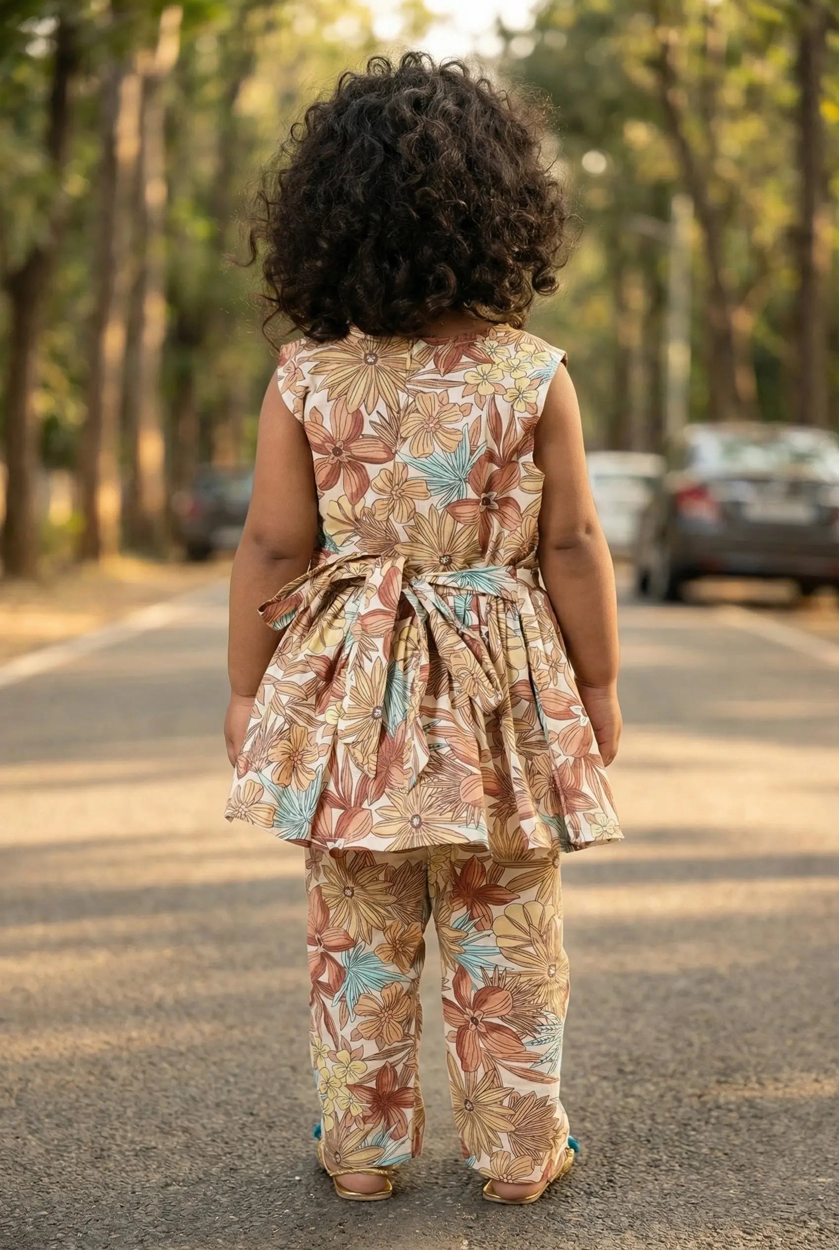 Close-up of vintage botanical floral print on cream cotton fabric – girls coord set terracotta teal floral Bebe Unicorn