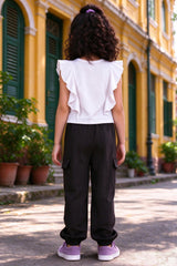 Back view of girls white top & black cargo pants set