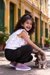 Side view of girls white top & black cargo pants set