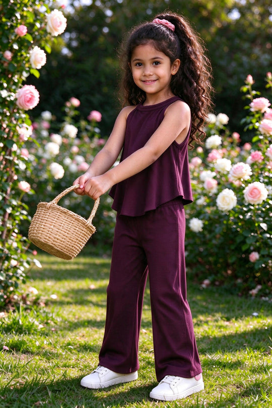 Girl wearing girls wine plum rib-knit halter top & flared pants coord set, front view