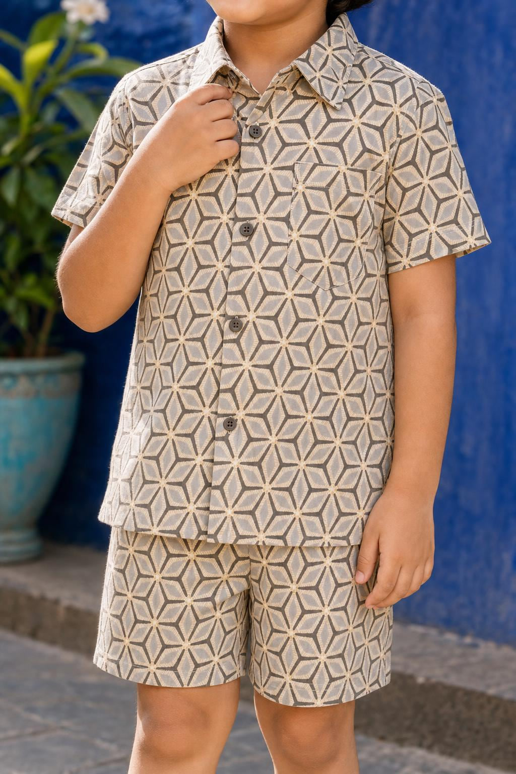 Close-up of boys casual geometric print cotton coord set shirt print, collar and buttons