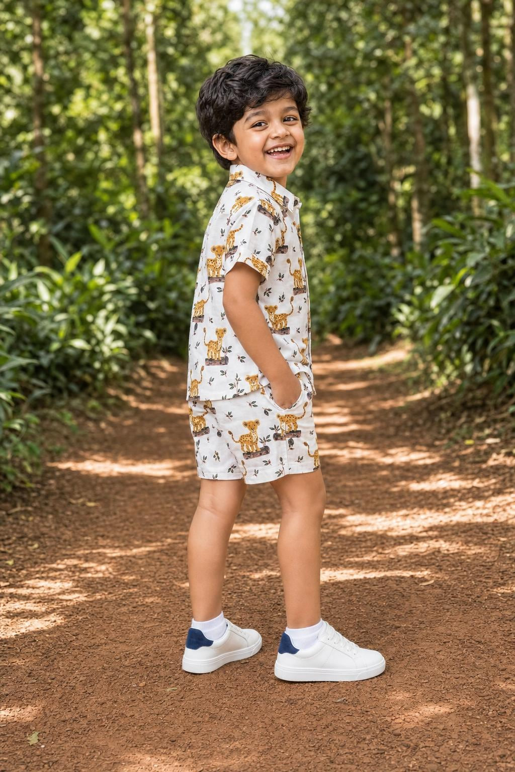 Side view of boys leopard cub print coord set shirt and shorts