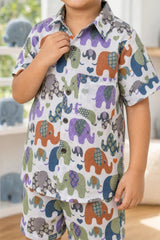 Close-up of boys multicolour elephant parade coord set shirt print, collar and buttons