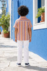 Back view of boys orange and purple zig-zag shirt