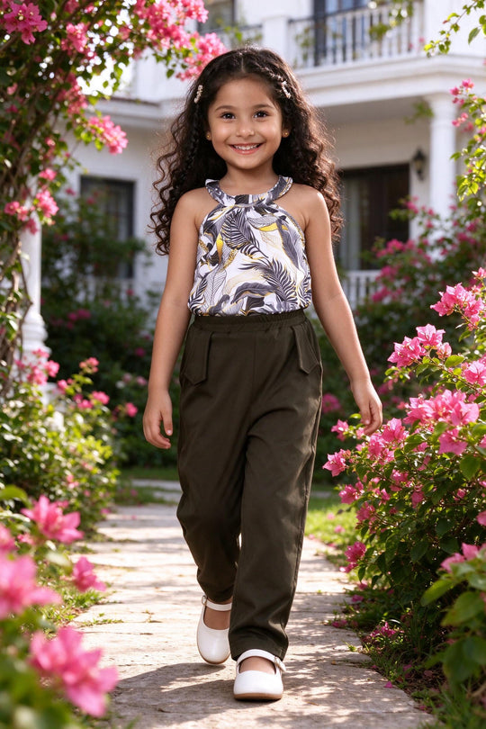 Girl wearing girls floral halter neck top & olive pants set, front view