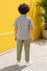 Back view of boys black and cream zig-zag print shirt